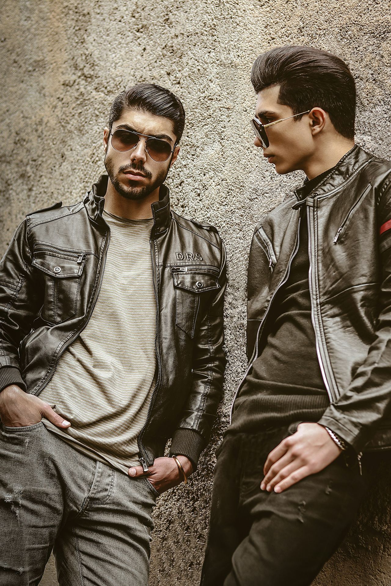 a couple of men standing next to each other